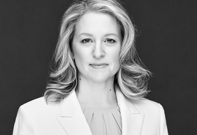 Lisa Habermehl wearing white on a black background